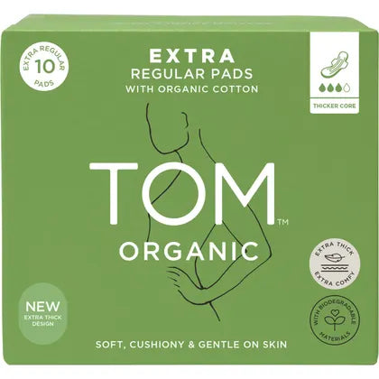 Box of TOM Organic extra regular pads with organic cotton on a green background